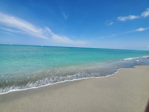 Beautiful water on a private beach. Beach chairs and umbrella included.