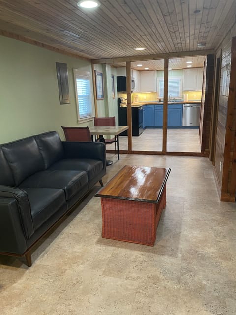 You enter lower Living Room through French doors with view of Kitchen