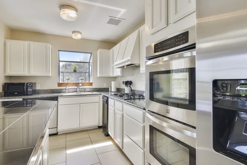 Large kitchen with Breakfast Coffee Bar Double Ovens & stainless appliances