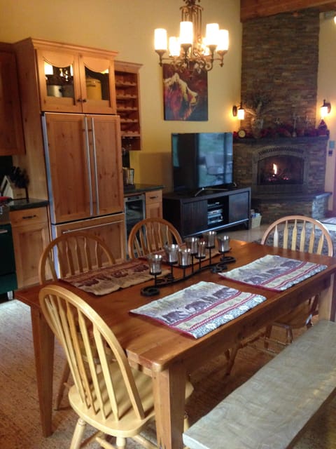 Great room with sofa, tv, gas fireplace, kitchen, half bath and office nook