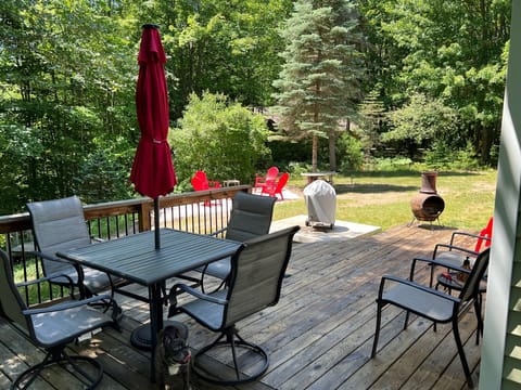 Ample seating with deck overlooking the river and roomy fire pit area.