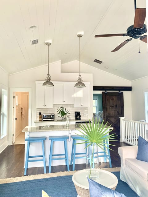 Upper level wet bar with counter seating for four. 
