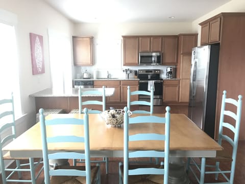 Dining and Kitchen area.  Bar has 2 bar stools to accomodate 8 eating.  