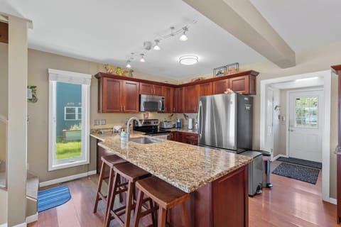 The kitchen features a breakfast bar, great cooking equipment and spices.