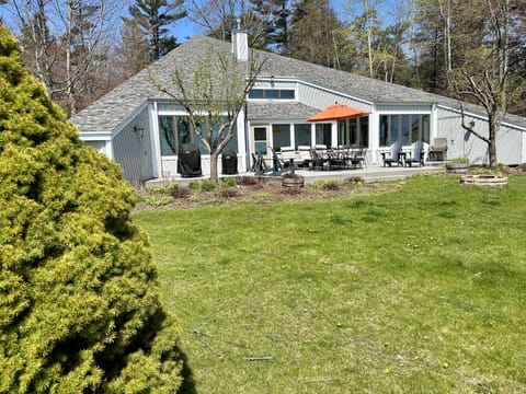 Property features an expansive yard with amazing waterfront views of the lake.