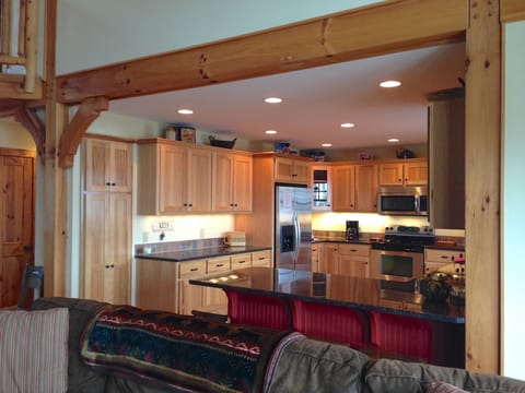 Kitchen is to the left as you walk in the door as seen in photo #1