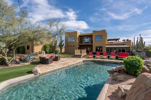 [Resort Property] Heated Saltwater pool with state-of-the-art Pebble Tec and waterfalls, with plenty of lounging