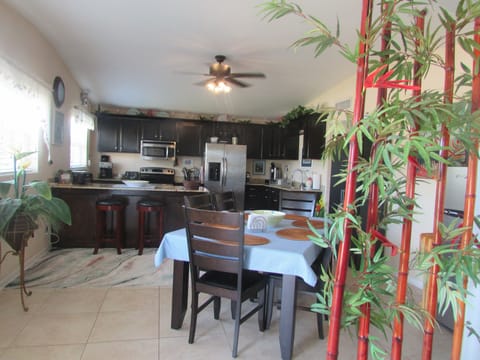 Large eat in kitchen for family dining.  Table, 6 chairs and 2 bar stools.