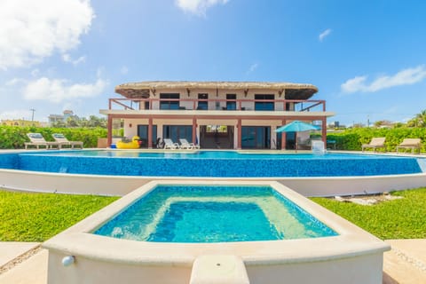 Back yard view of the dipping pool, main pool and back of the Casa