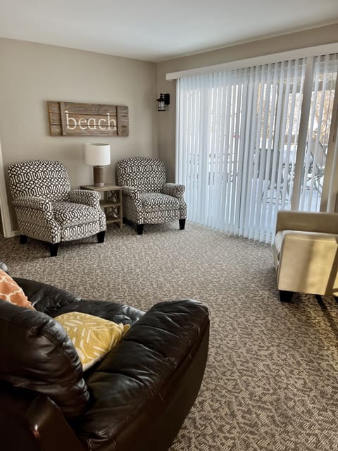 Living room with sliding glass doors. Views of lake. 