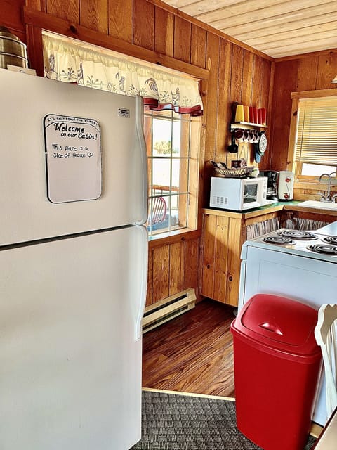The full size refrigerator and kitchen