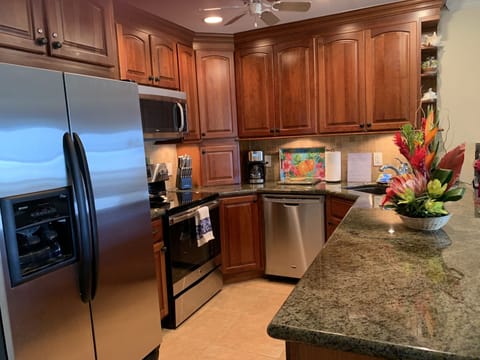 A full size refrigerator, stove and oven.
