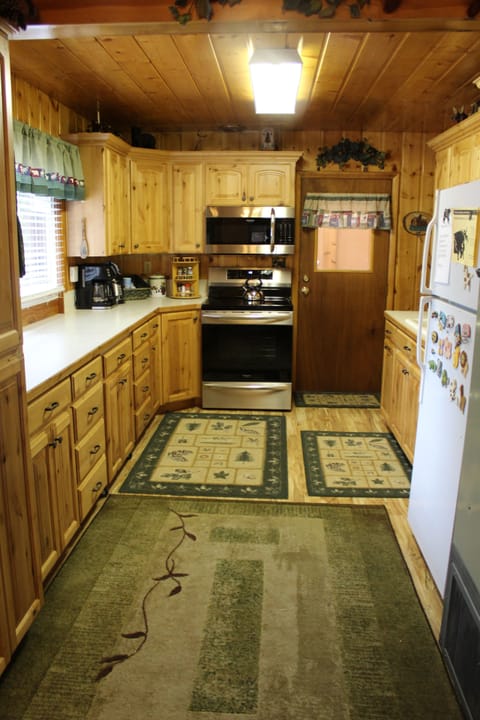 Kitchen with (new in 2022) Microwave and Induction Range with Oven/Air Fryer