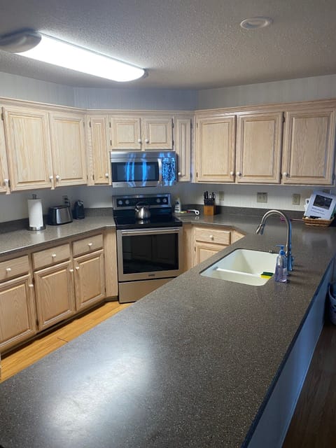 Fully stocked kitchen. You provide food. 