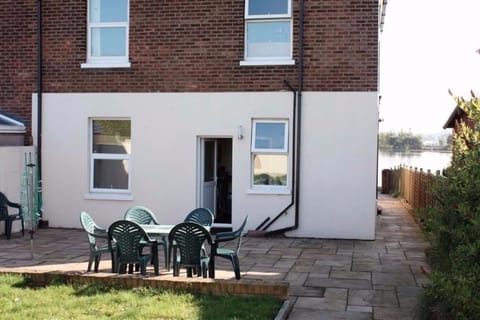 Rear Garden with garden furniture to capture the evening sunshine. 