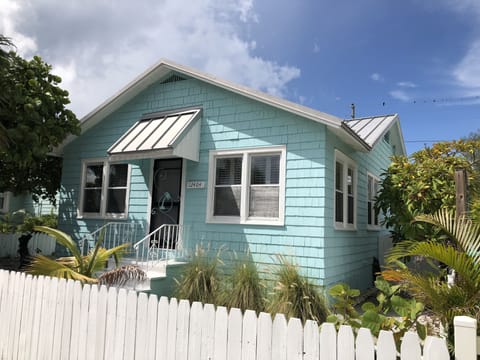 Front Exterior w/shake siding,, metal roof & white picket fence