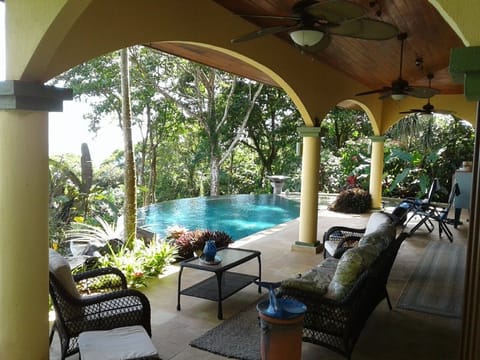 Covered veranda by infinity pool