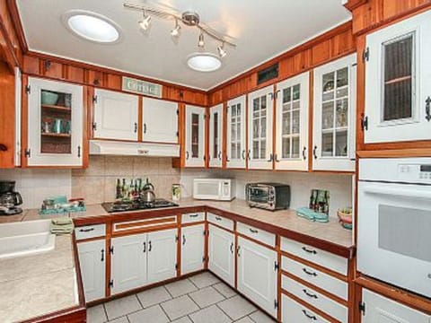 Compact yet complete kitchen has your first morning of complimentary coffee.