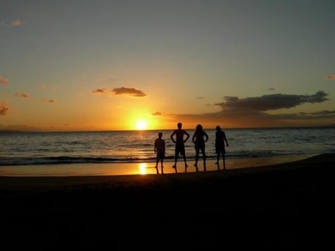 our family watching the sun set at Charley Young Beach