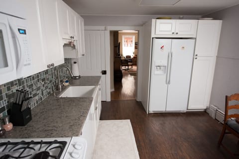 Kitchen looking into living and bedroom area