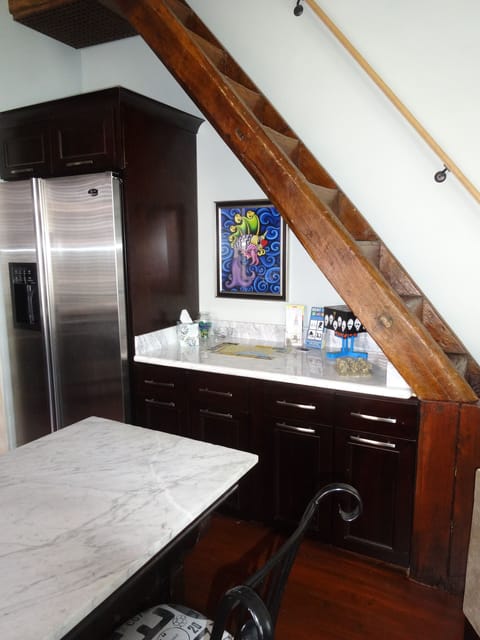 Fridge has ice & water dispenser. Counter under stairs has maps and info for you