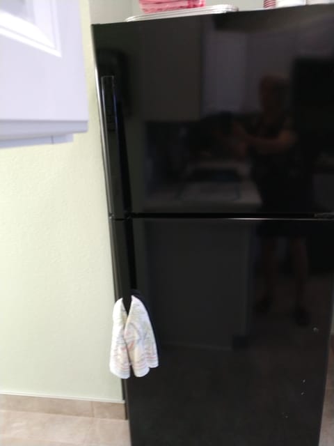 Full size refrigerator with ice maker.