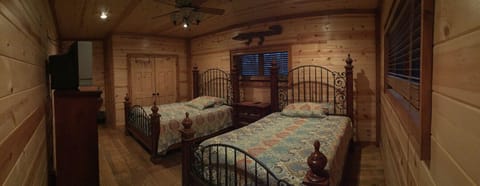 Guest bedroom on main floor can sleep four plus space for two portable beds.