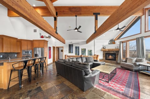 Living room with large couches, TV and wonderful view