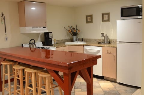 Full kitchen with stove, DW, refrigerator and microwave.