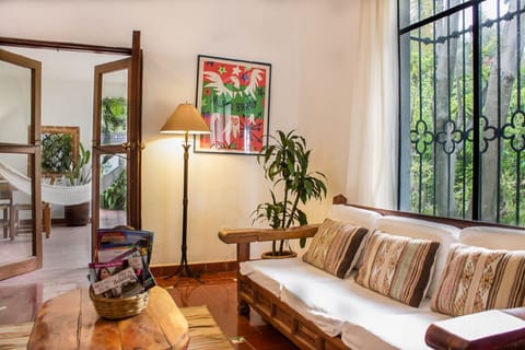 Living room decorated with handmade textiles, furniture and folk art.
