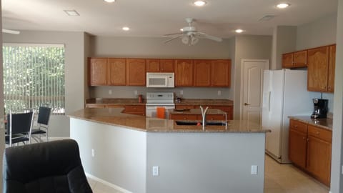 Open concept kitchen for entertaining with nook