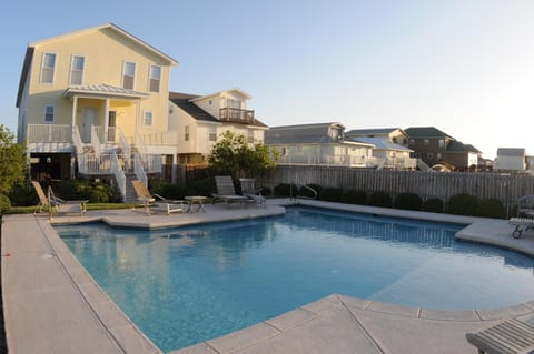 Rear view of house and beautiful pool with shallow area for the little ones.