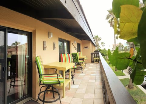 Private balcony with 2 tables and 4 chairs