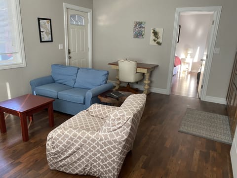 Living area and door to bedroom