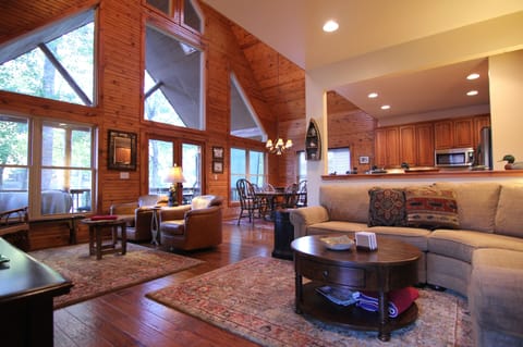 As you enter, you are greeted with a wall of windows facing he lake.