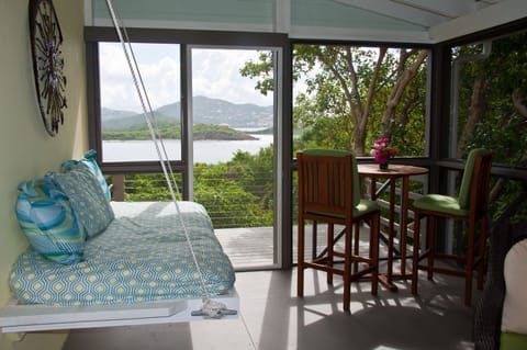 Comfy porch bed. Deck with stainless steel cable railing.