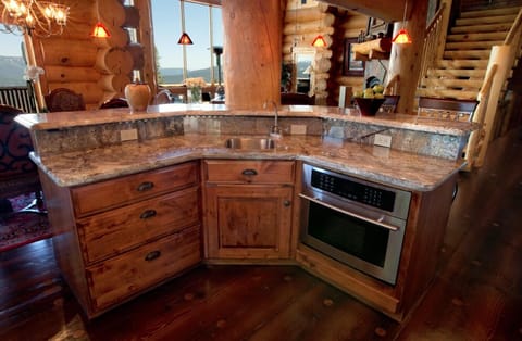Kitchen island with wet bar and built-in microwave