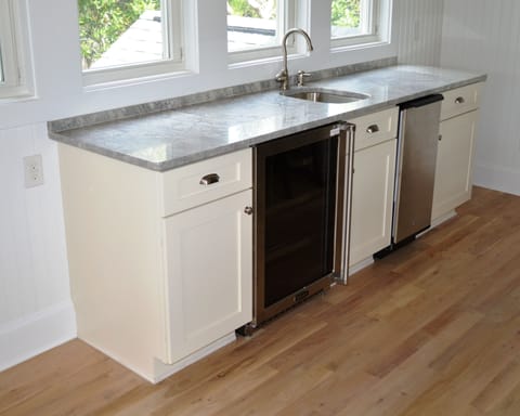 Beverage center with wine refrigerator and 50lb/day fresh ice maker.