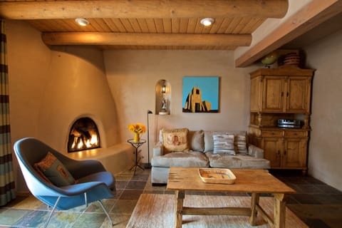 Living room, with gas-fired Kiva fireplace and down-filled soft. 
