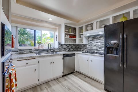 Kitchen is fully stocked, cabinets are open so finding things is easy. 