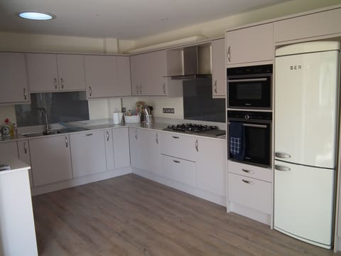 Fully equipped kitchen with sun tunnel.