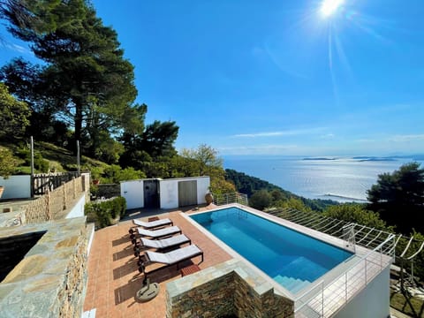 Enclosed sheltered private pool and outdoor shower area and sunny sea views. 