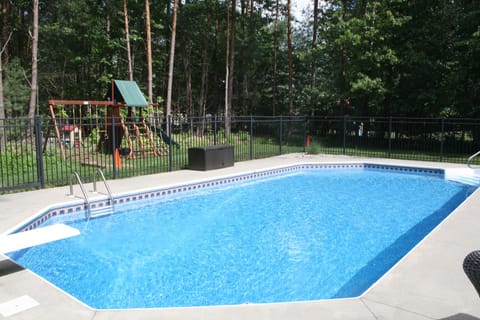 In-ground pool, tons of pool toys, backyard playground, and horseshoe pit