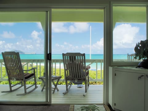 Living room to Lanai.  4 teak Rockers, 2 teak Steamer Chairs, 