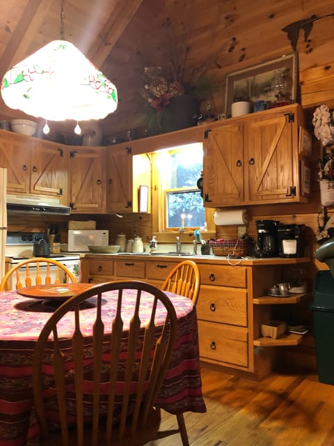 Full kitchen complete with pots, pans, dishes and utensils.