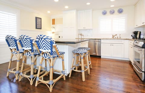 Kitchen island seats 5 comfortably.  Gas stove. New microwave and dishwasher.
