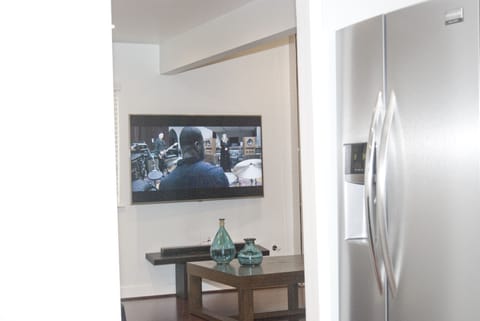 Watch the TV from the kitchen -  don't miss any of the action