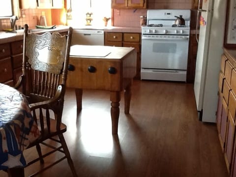 Large and spacious custom kitchen  with antique oak chopping block. 