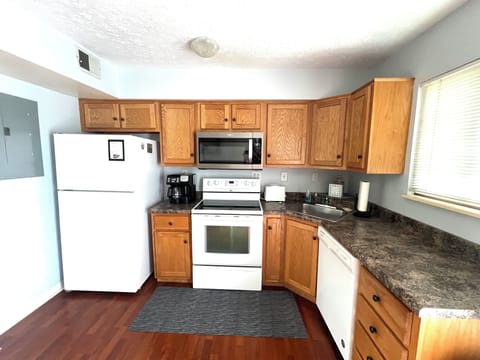 FULLY EQUIPPED KITCHEN with plenty of cookware.
