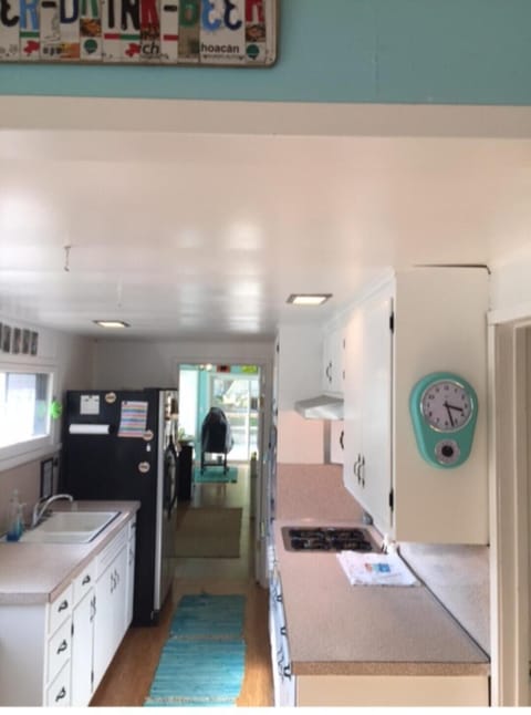 View of kitchen through to back living area